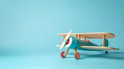 عکس هواپیمای اسباب بازی پرنعمت را در  پس زمینه آبی ایجاد کرد