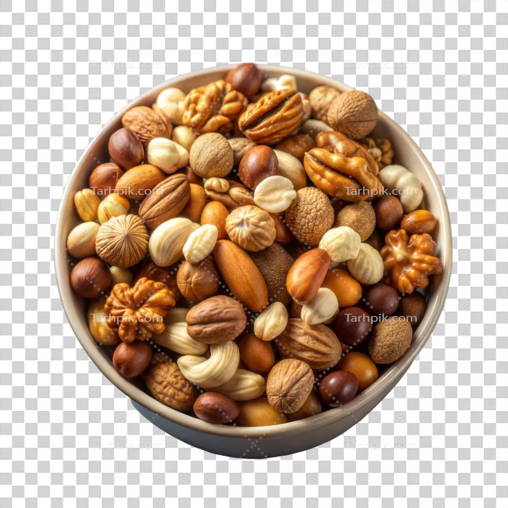 عکس دوربری مخلوطی از آجیل های خوشمزه و سالم در یک کاسه برای میان وعده