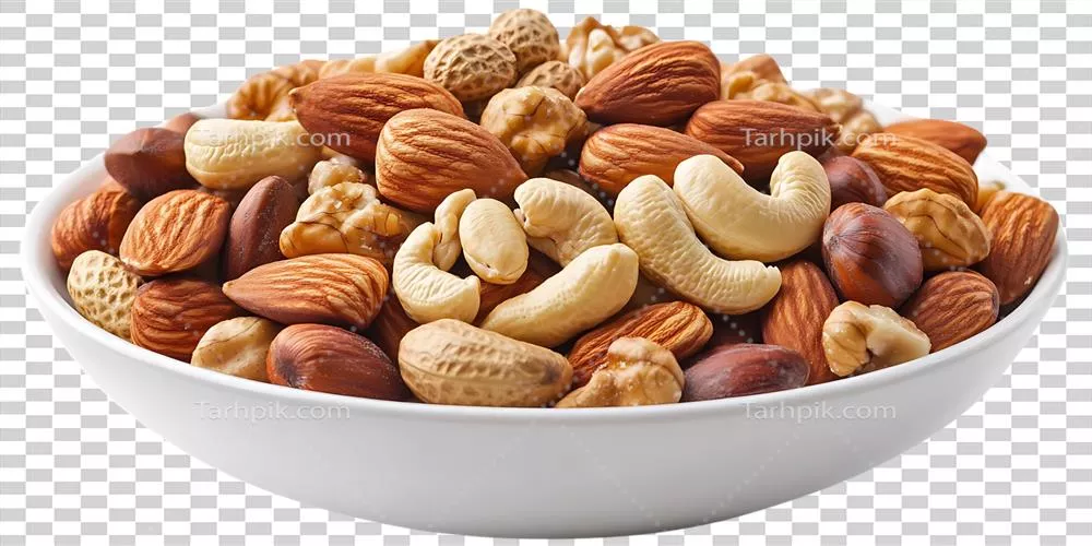 عکس دوربری مخلوطی خوشمزه از آجیل های مختلف در یک کاسه شفاف