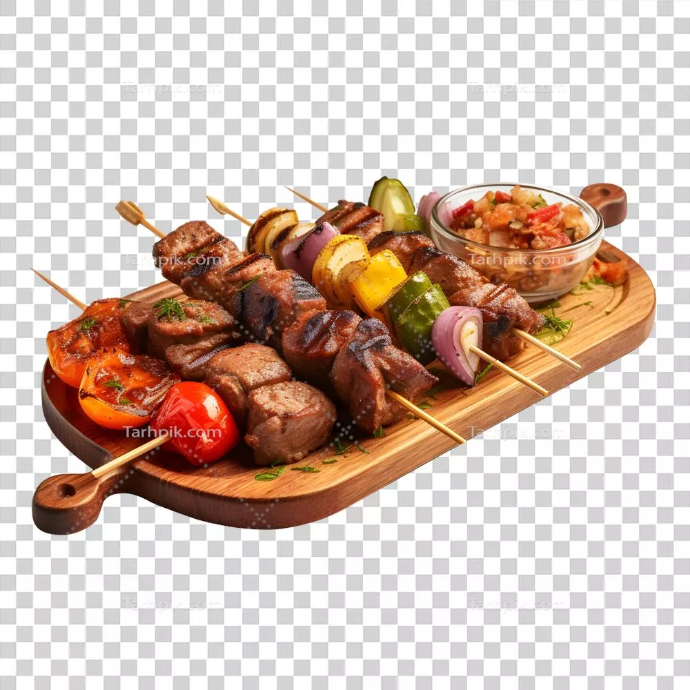 عکس دوربری کباب خوشمزه با گوشت گوساله و سبزیجات روی صفحه چوبی