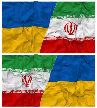 عکس دوربری ترکیب پرچم های ایران و اوکراین با بافت پارچه ای برای نمایش روابط دو جانبه