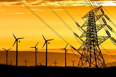عکس تولید انرژی الکتریکی توسط توربین های بادی در غروب آفتاب