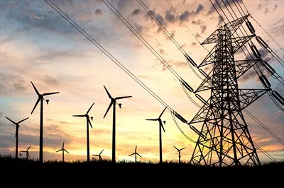 عکس تولید انرژی پاک توسط توربین های بادی در غروب آفتاب