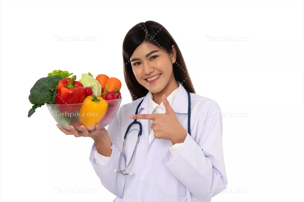 عکس متخصص تغذیه با میوه های تازه در کلینیک، نماد سلامتی و رژیم غذایی مناسب