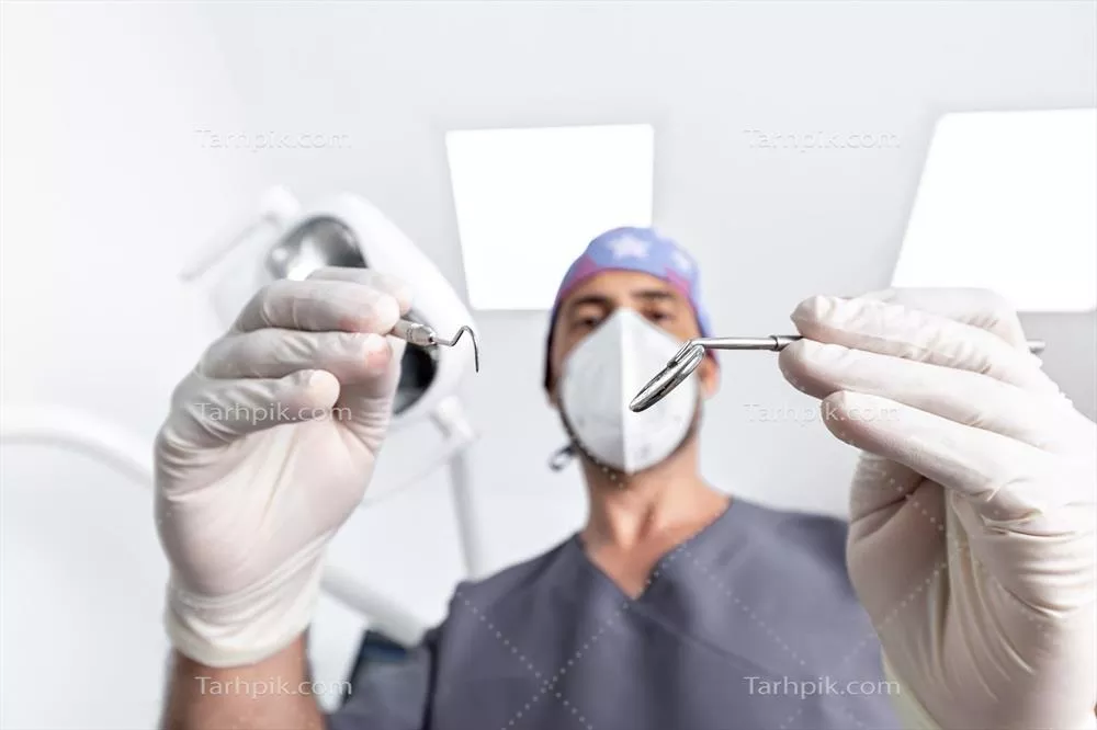 عکس تمرکز انتخابی بر روی ابزارهای مورد استفاده دندانپزشک در کلینیک دندانپزشکی