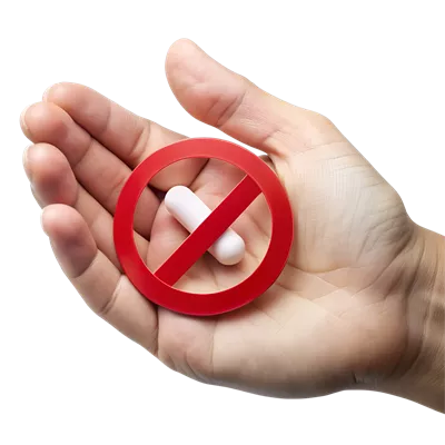 عکس دوربری تصویری از دست holding یک قرص با علامت عدم مصرف دارو