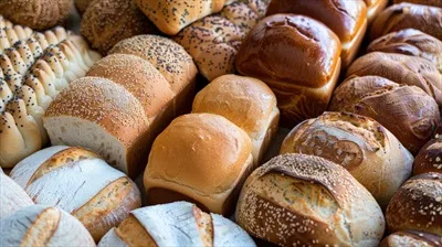 عکس محصولات نانوایی متنوع تولید شده با هوش مصنوعی شامل نان و نان های گرد