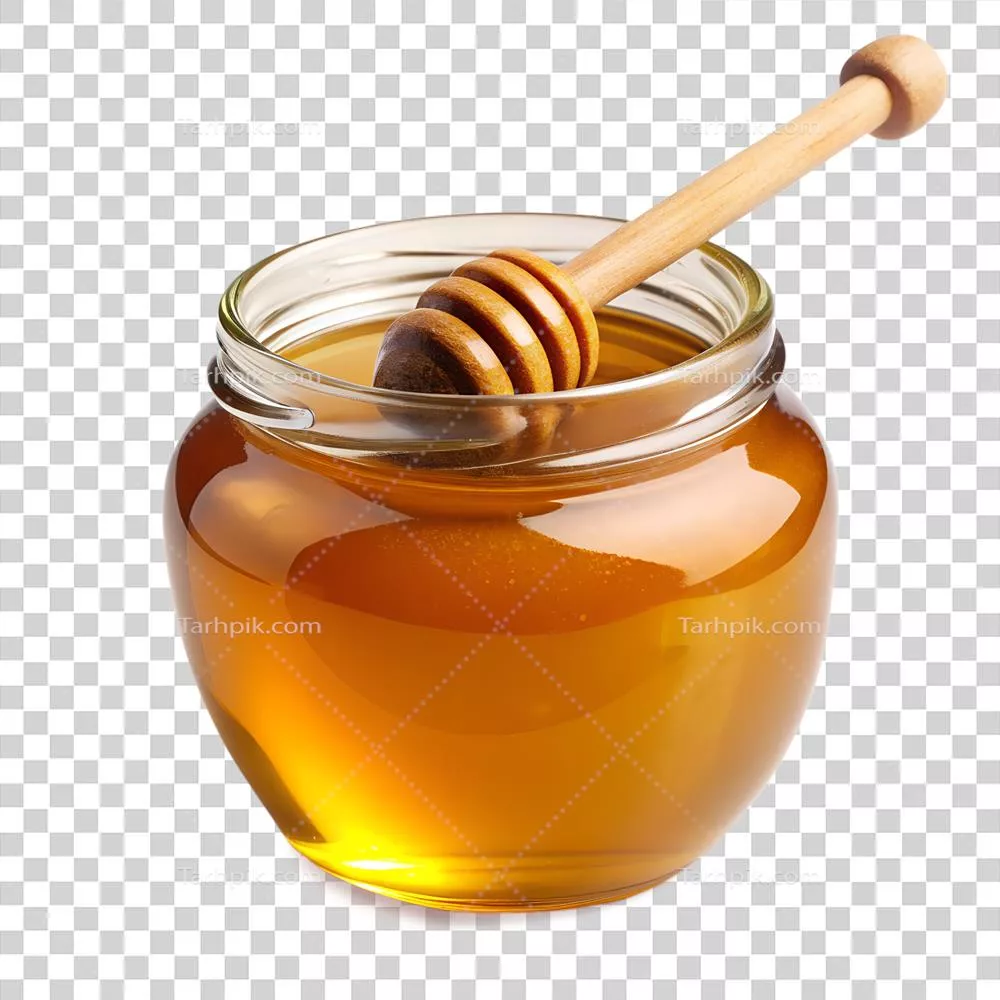 عکس دوربری عسل طلایی درون شیشه با قاشق چوبی، نمایی شفاف و جذاب