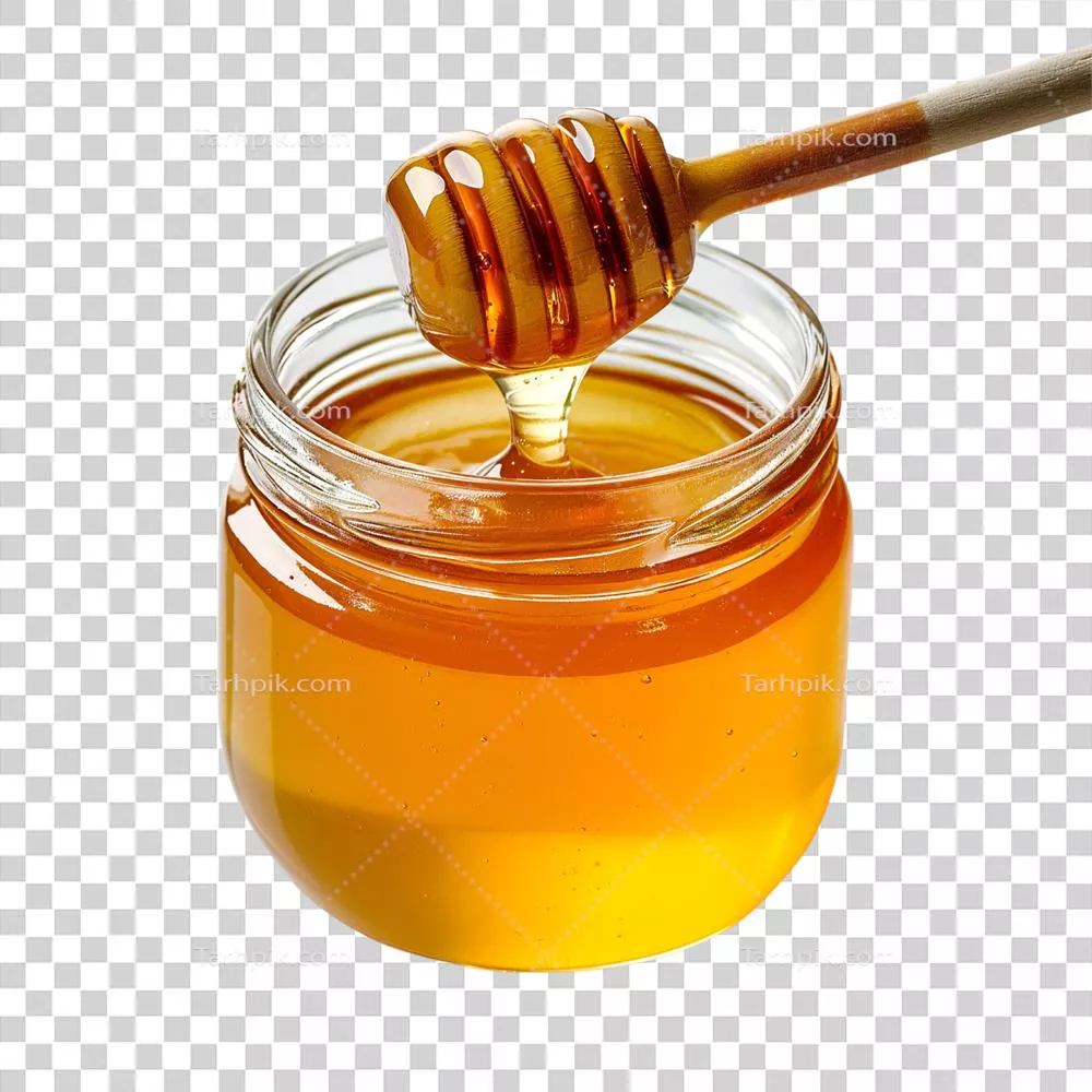 عکس دوربری عکس جذاب و خوشمزه از یک شیشه عسل ارگانیک با قاشق مخصوص