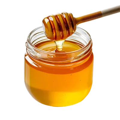 عکس دوربری عکس جذاب و خوشمزه از یک شیشه عسل ارگانیک با قاشق مخصوص