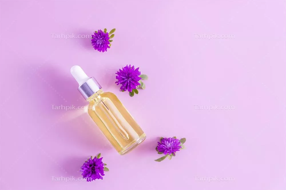 عکس بطری شیشه ای قطره چکان با سرم صورت برای مراقبت از پوست