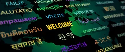 عکس خوش آمدگویی به زبان های مختلف با پس زمینه نقشه جهان