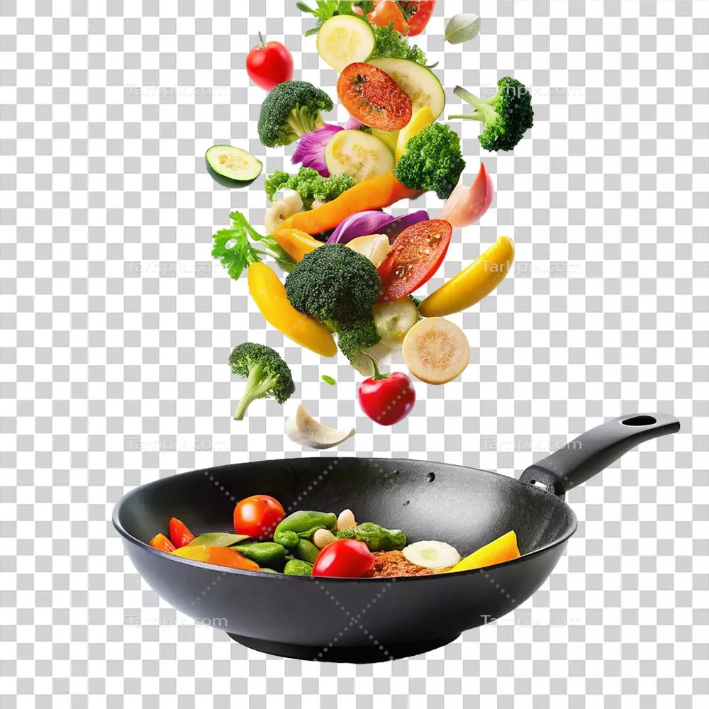 عکس دوربری سبزیجات رنگارنگ در حال سقوط به داخل تابه وک سیاه برای تهیه یک وعده غذایی خوشمزه و سالم