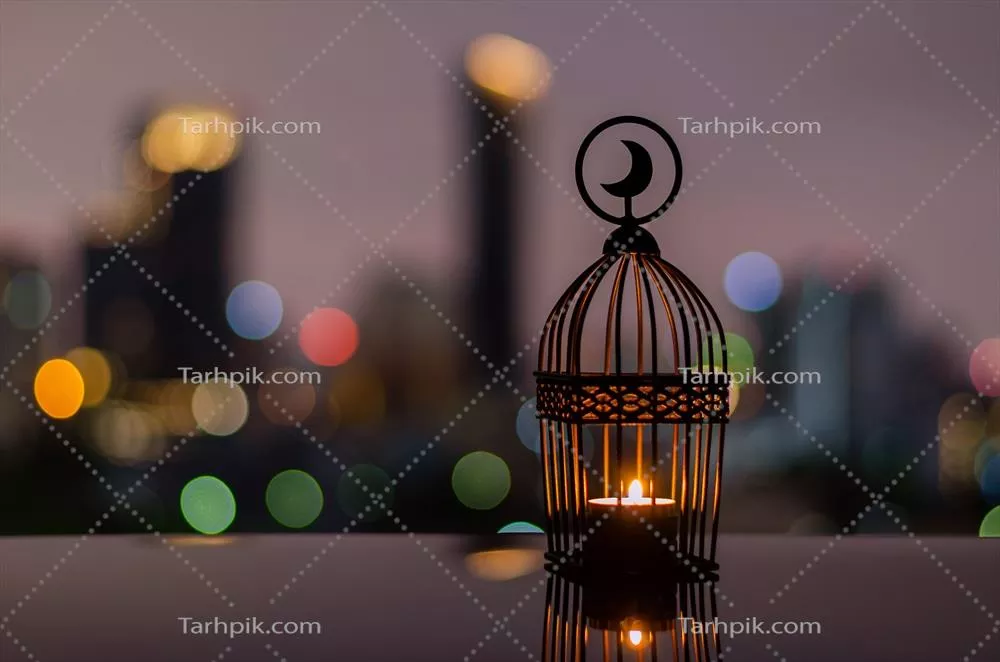 عکس چراغ های زیبا در آسمان غروب و نورهای شهر برای جشن رمضان
