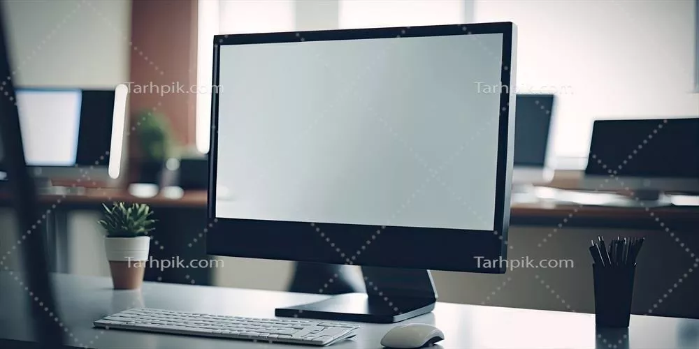 عکس نمای نزدیک از فضای کاری مدرن با میز و لوازم اداری در اتاقی مبهم