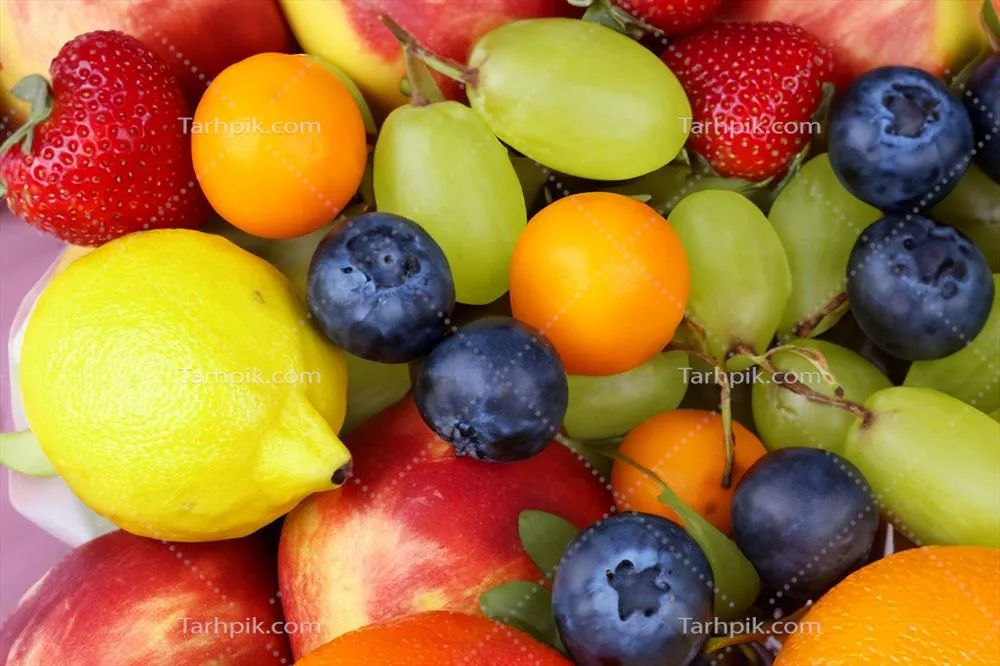 پس‌زمینه‌ای زیبا از میوه‌های گرمسیری و رنگارنگ با تنوعی از نعمت‌های طبیعت