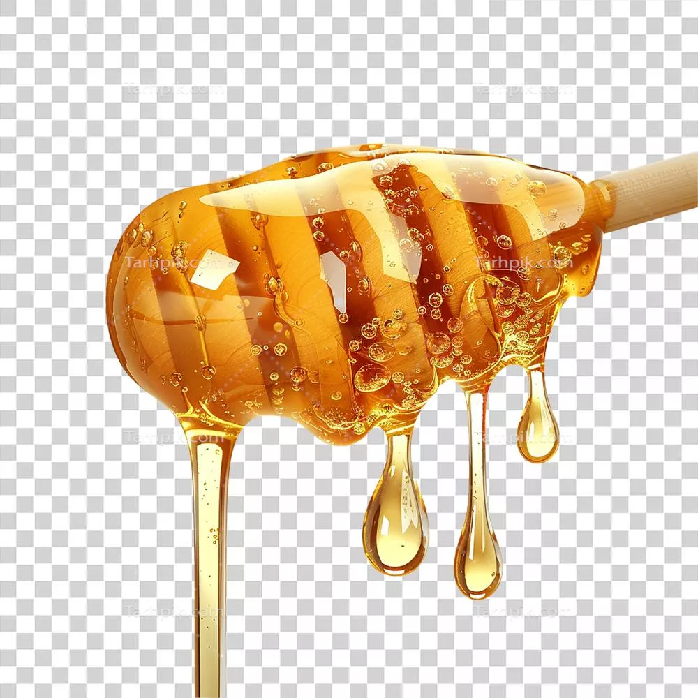عسل طلایی با چکه کردن از قاشق عسل؛ خوراکی طبیعی و شیرین