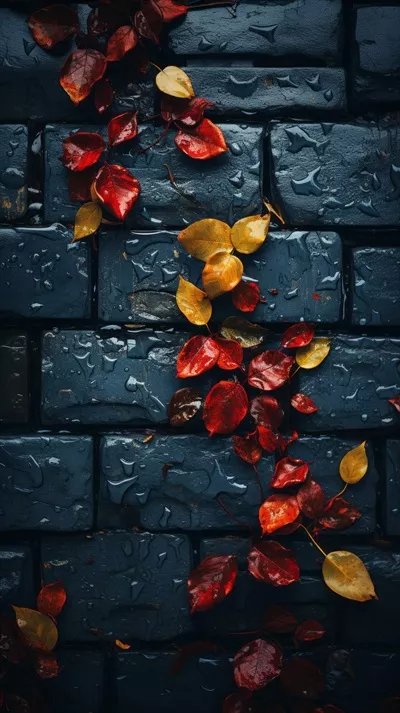 تصویرسازی پاییزی با برگهای زرد و قرمز بر روی دیوار آجری