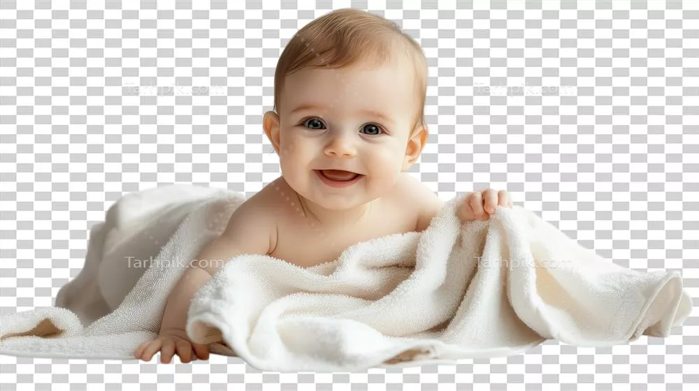 کودک نشسته بر روی پتوی نرم با چهره‌ای شاد در خانه در طول روز