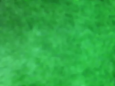 پس‌زمینه‌ای انتزاعی و تار از چمن سبز برای طراحی‌های هنری