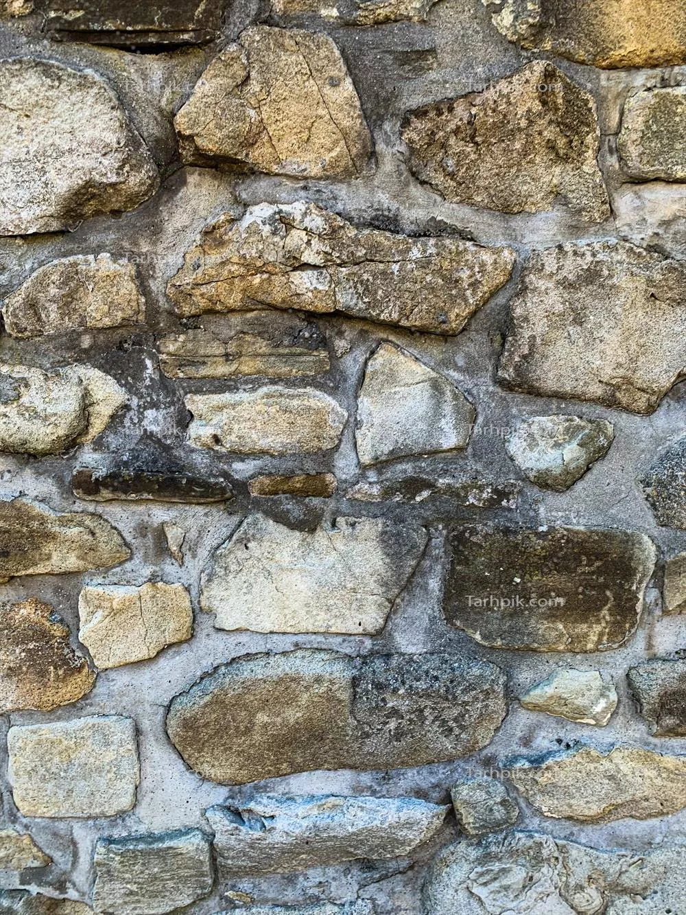 پسزمینه دیوار سنگی قدیمی با بافتهای سنگی زیبا و جذاب