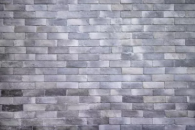پسزمینه دیوار آجری خاکستری با بافت گرانج و زبر