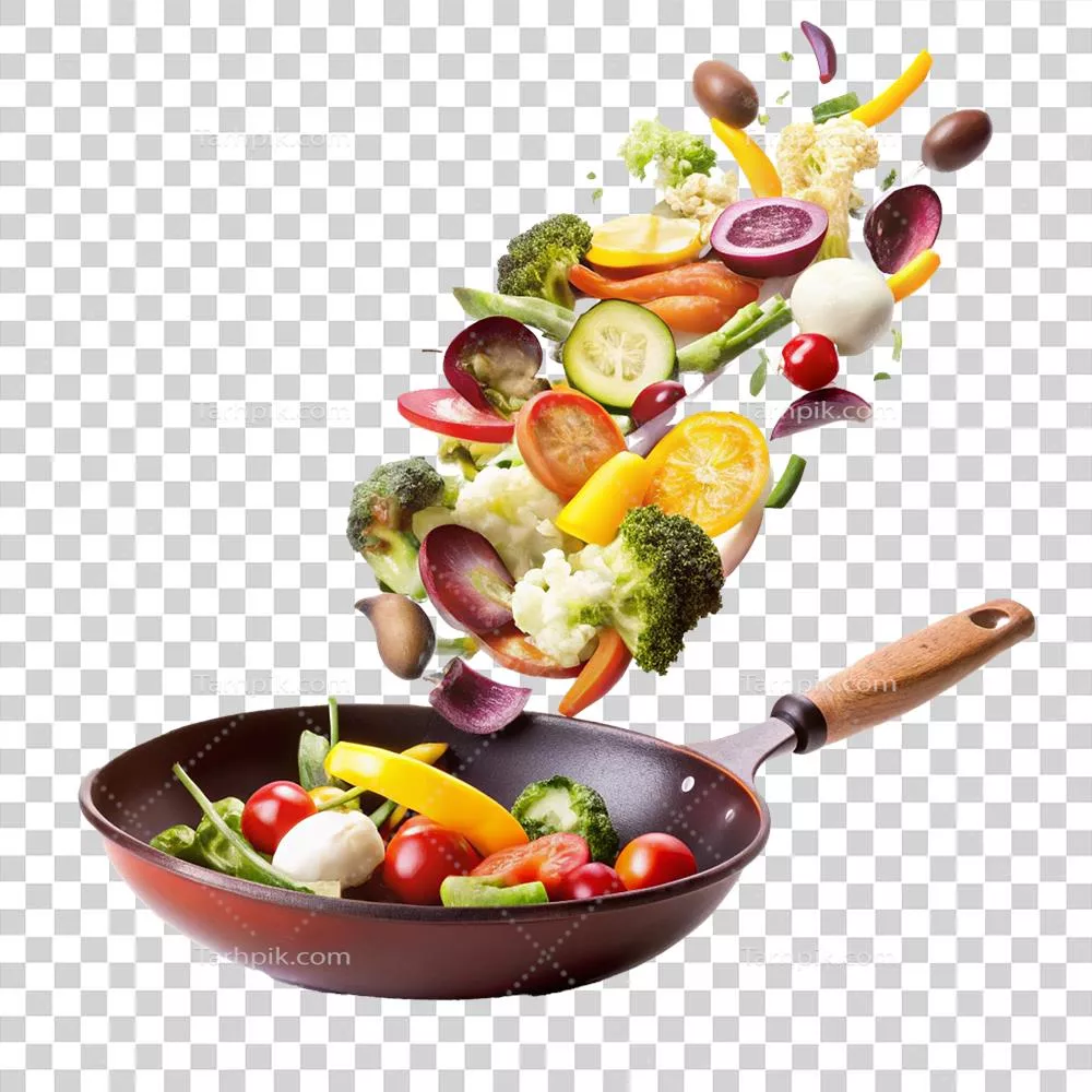 سقوط یک آرایه رنگارنگ از سبزیجات تازه به درون تابه قرمز برای یک وعده غذایی خوشمزه و سالم