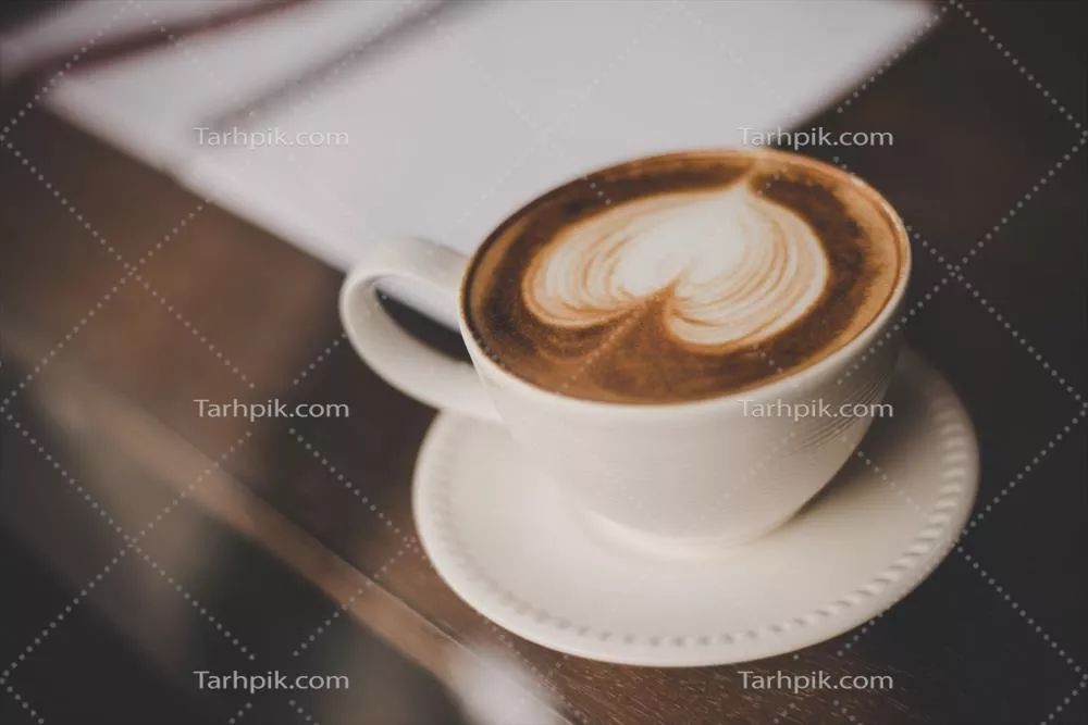 عکس فنجان قهوه داغ با طراحی هنری قلبی شکل به سبک وینتج