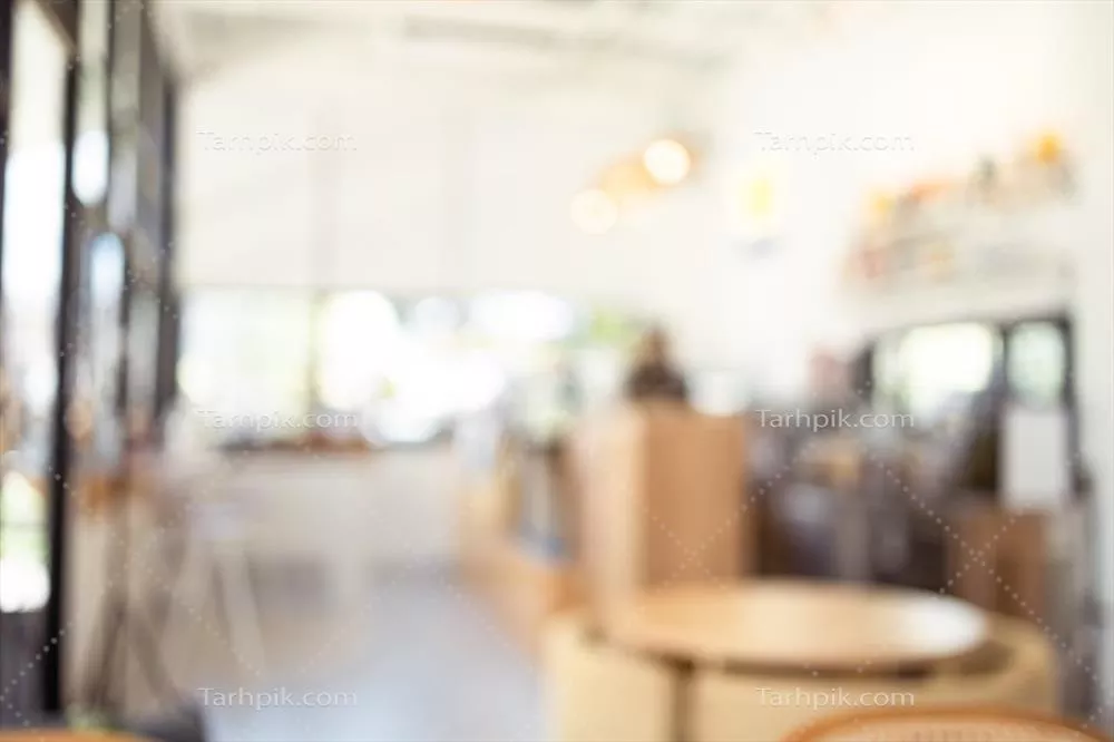 عکس تصویری محو از یک کافه زیبا و به خوبی تزئین شده با نور روشن