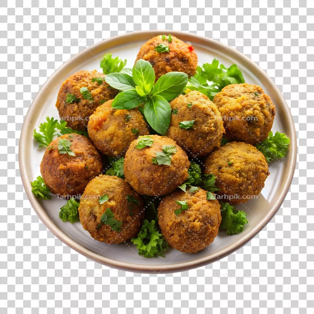 عکس دوربری کوفته‌های فلافل خوشمزه روی یک بشقاب با سبزیجات تازه و شفاف