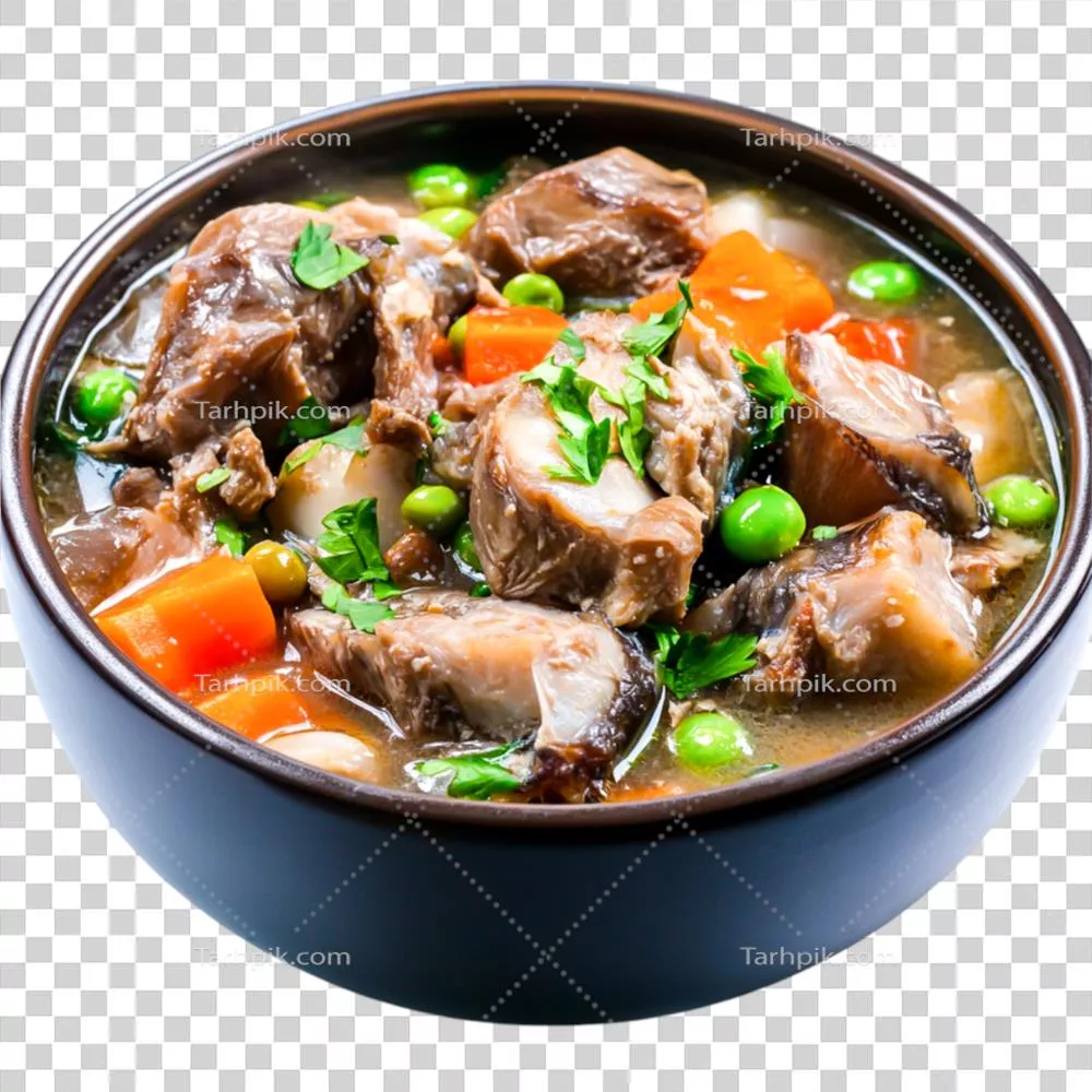 عکس دوربری خورشت مقوی با گوشت و سبزیجات در کاسه تیره با گیاهان تازه و مواد رنگارنگ