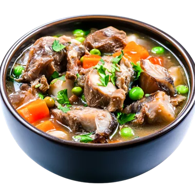 عکس دوربری خورشت مقوی با گوشت و سبزیجات در کاسه تیره با گیاهان تازه و مواد رنگارنگ