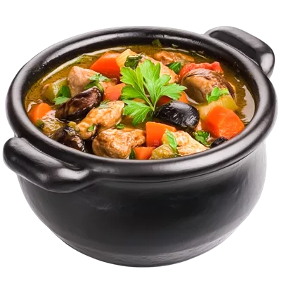 عکس دوربری خورش خانگی خوشمزه در دیگ سیاه با سبزیجات تازه و گیاهان معطر