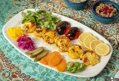 عکس سینی جوجه کباب حلزونی