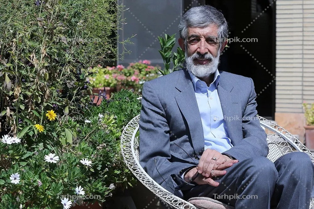 عکس غلامعلی حدادعادل کنار باغچه گل با کیفیت بالا